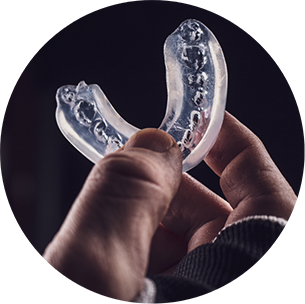 Athlete holding a mouthguard